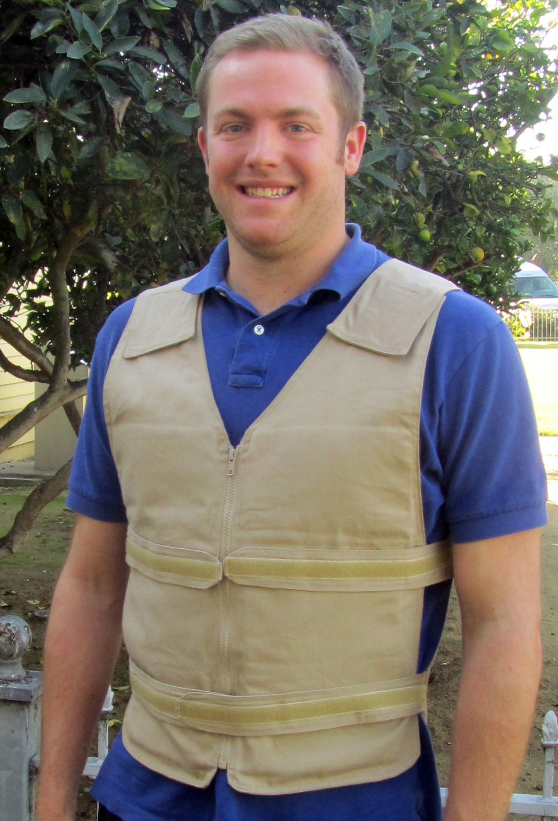 Man wearing khaki adjustable zipper front cooling vest
