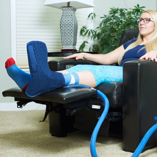 Woman wearing an ice cold water cooling compression pad on her ankle and foot
