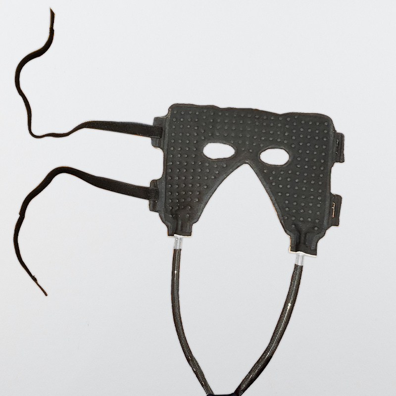 The cold circulating water therapy face mask placed on a table 