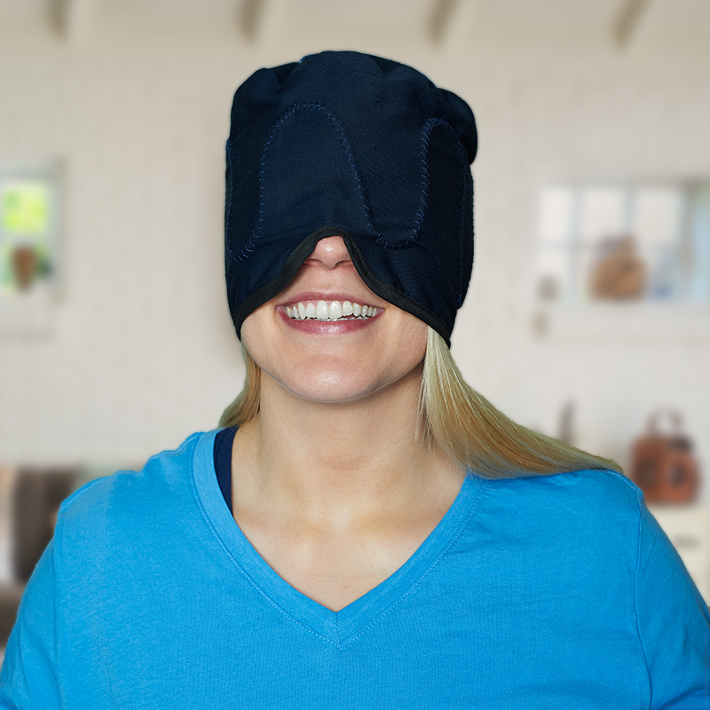 Mannequin wearing a neck and scalp cold water ice pad circulating head cap side view