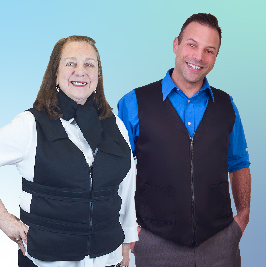 Woman wearing a black adjustable zipper front cooling vest with deluxe cooling neck wrap and Man wearing a black fashion cooling vest