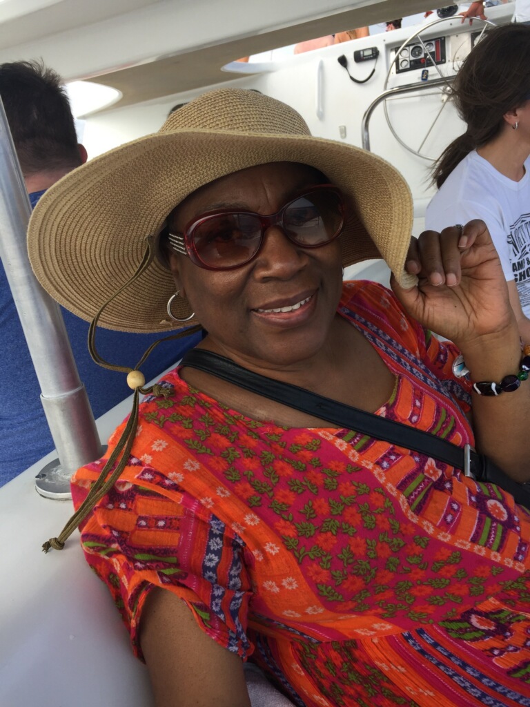 Woman wearing a Cool Comfort cooling straw hat