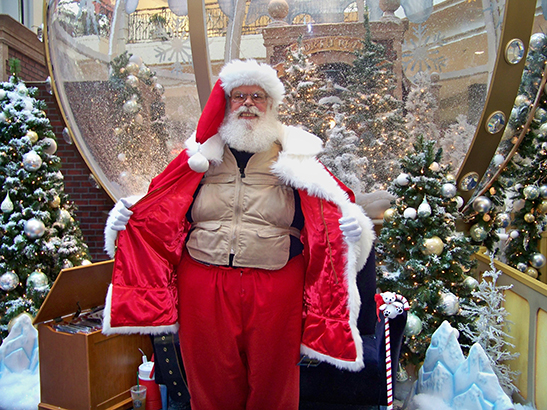 Santa wearing a khaki Kool Max adjustable zipper front cooling vest