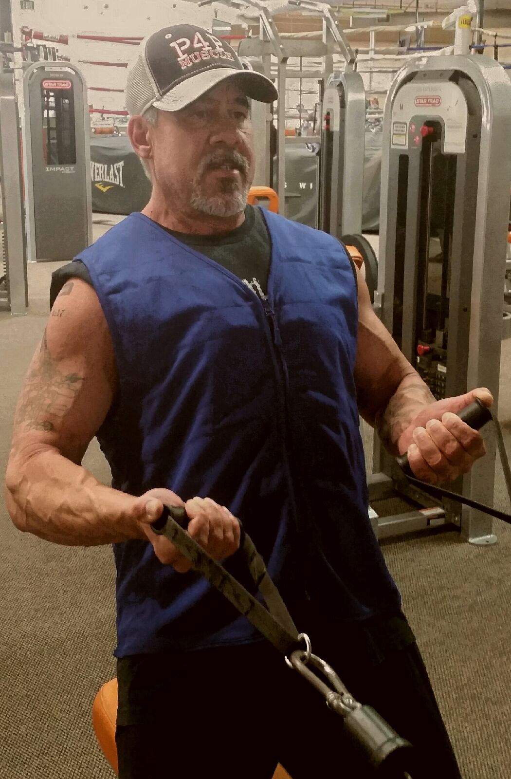 Man working out wearing a Cool Comfort deluxe sports vest