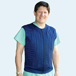 Man wearing a blue cool flow fitted circulating water cooling vest