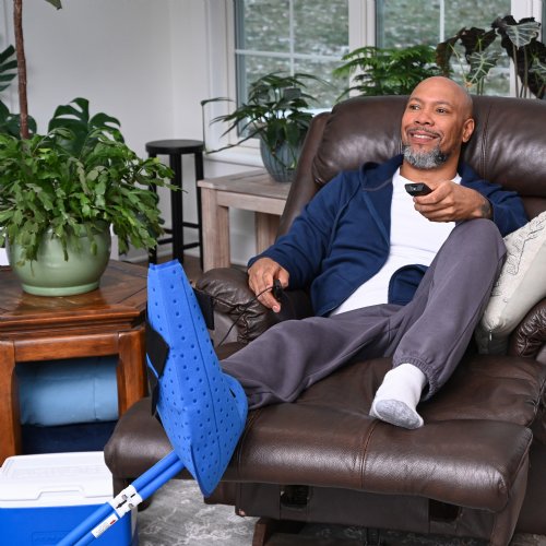 Active Ice 3.0 Foot and Ankle Cold Therapy system with blue 9 Quart Cooler by itself against a white background