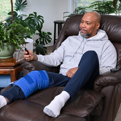 an active ice cold water therapy system full coverage knee displayed to show its contents 