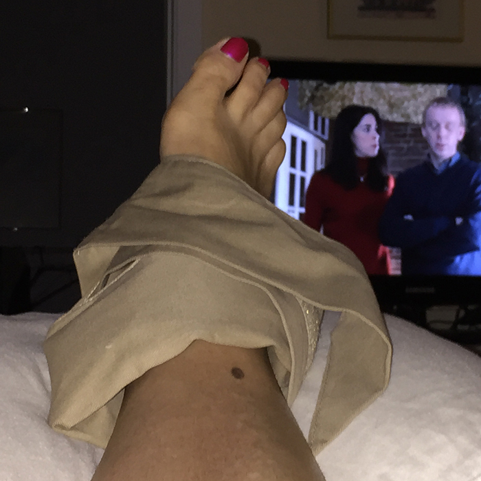 Woman with a Soft Ice foot and ankle wrap around her ankle