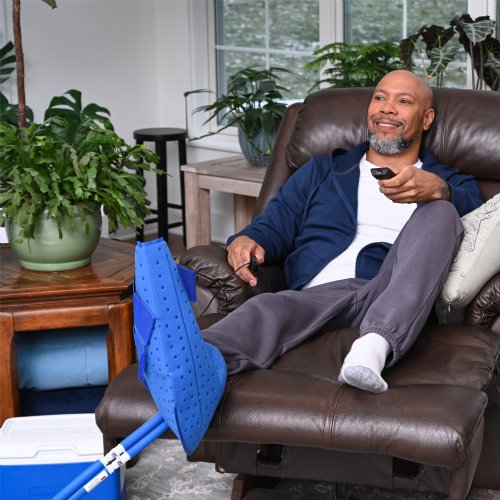 Active Ice 3.0 Foot and Ankle Cold Therapy system with blue 9 Quart Cooler by itself against a white background