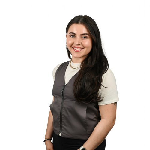 a woman wearing a khaki fashion vest two koolmax packs are shown next to her