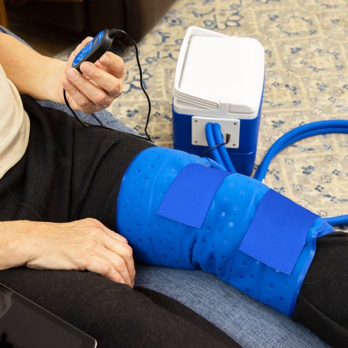 an active ice cold water therapy system full coverage knee displayed to show its contents 