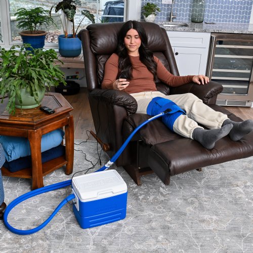 an active ice cold water therapy system full coverage knee displayed to show its contents 