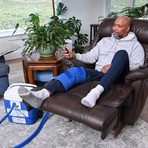 an active ice cold water therapy system full coverage knee displayed to show its contents 