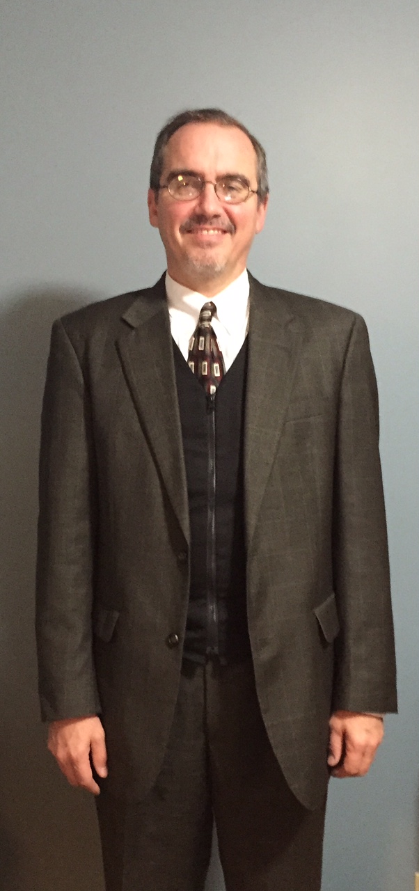 Man wearing a men's fashion cooling vest under a suit
