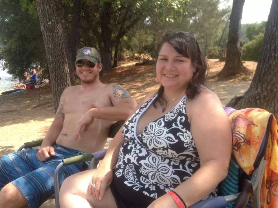 Woman wearing a kool max secrets vest under her bathing suit at the beach