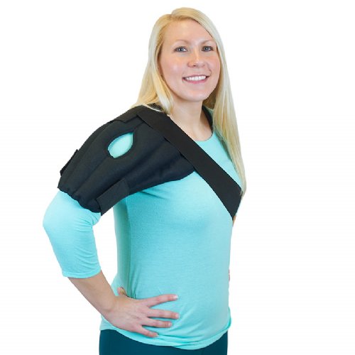 A woman wearing a Moist Heat Shoulder Wrap on her shoulder