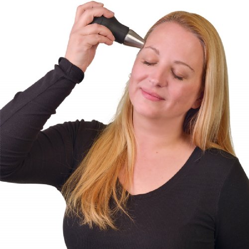 a ice massage tool is shown being applied to a womans temple