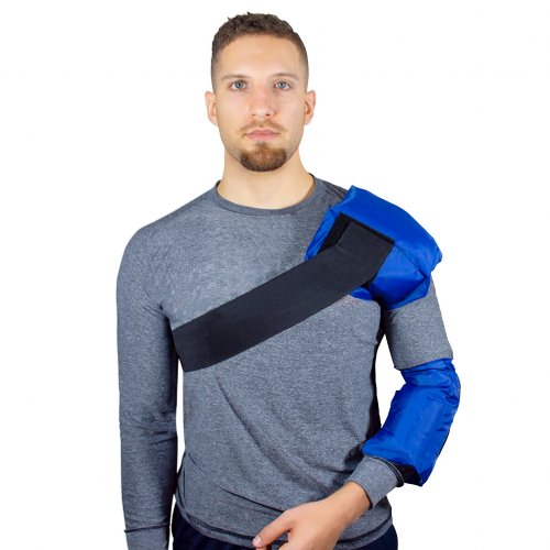 shoulder hot and cold gel ice compression therapy wrap worn on atheletic man 