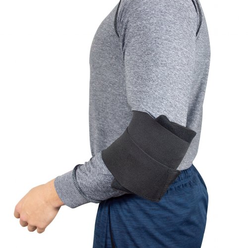 Atheletic man wearing hot and cold ice pack with elbow cold wrap