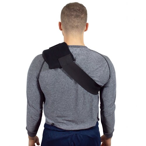 shoulder hot and cold gel ice compression therapy wrap worn on atheletic man 