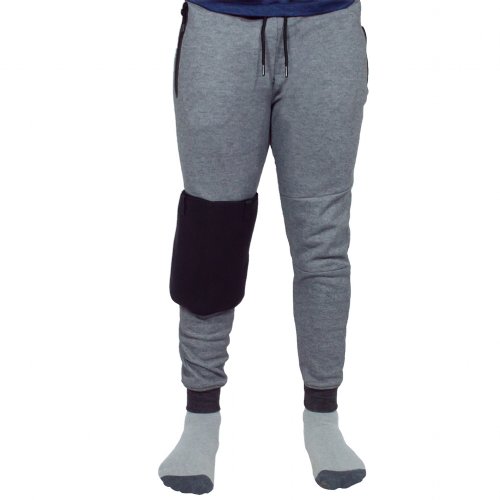 Atheletic man with hot and cold therapy ice pack brace wrapped on knee