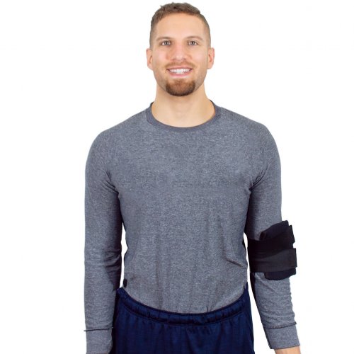 Atheletic man wearing hot and cold ice pack with elbow cold wrap